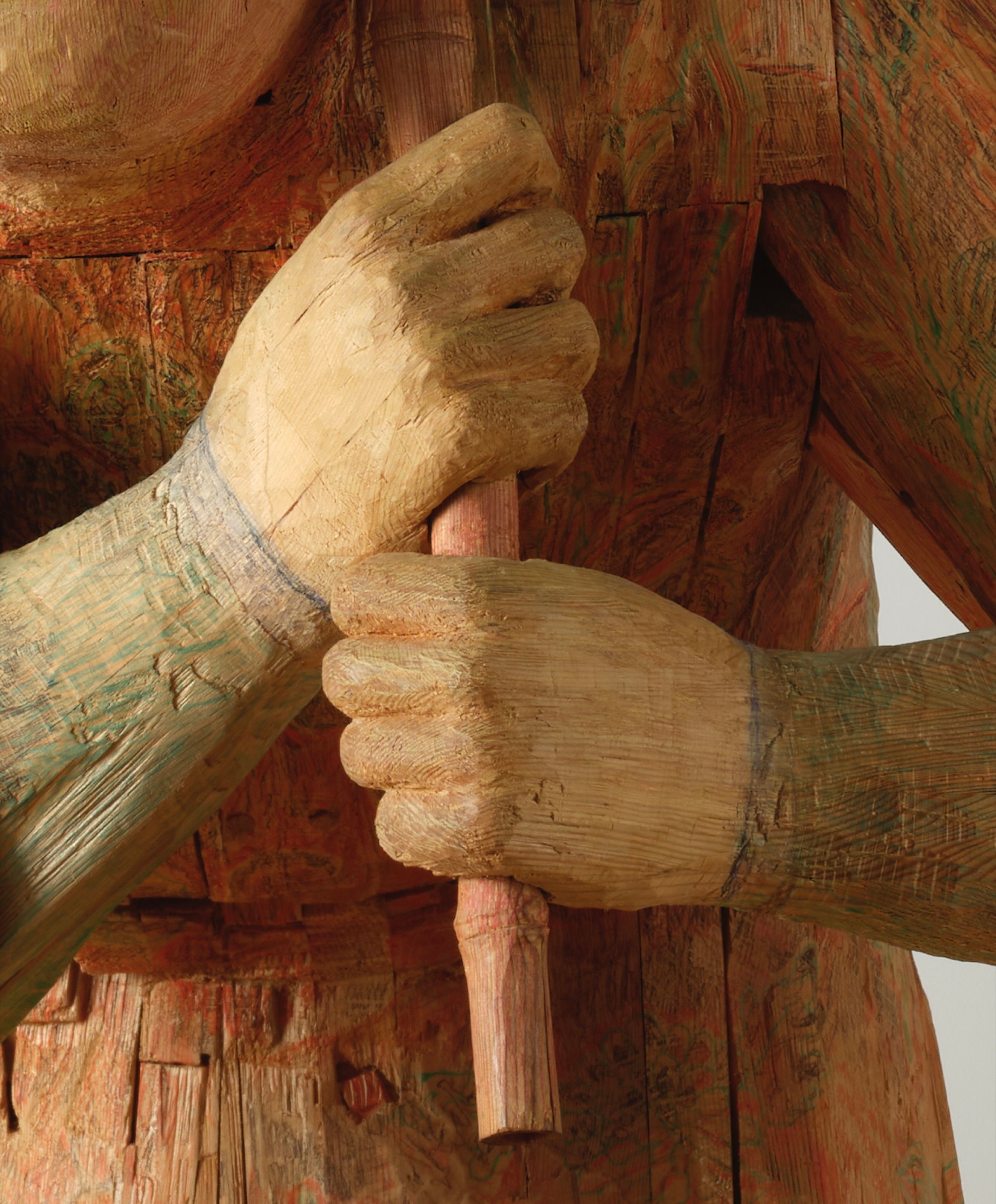 Detail of the hands on the Bob sculpture.